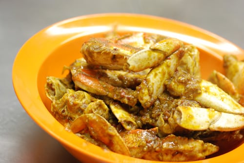 Chili crab in a typical Malaysian orange plastic bowl Chili crab in a typical Malaysian orange plastic bowl