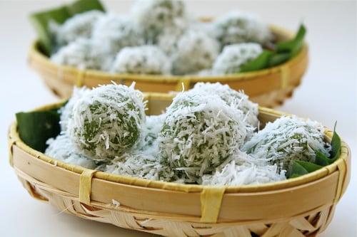 Onde-onde (Ondeh-ondeh) recipe - These cute little pastries are infused with pandan (screwpine leaf) juice and filled with “Gula Melaka” or palm sugar and then rolled in with some fresh grated coconut. | rasamalaysia.com