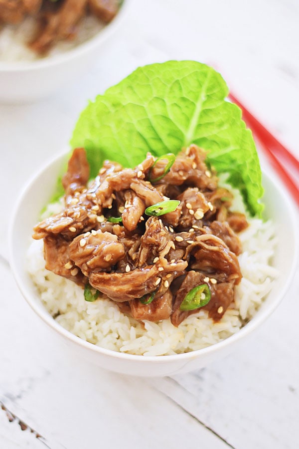 Easy Crock Pot Honey Sesame Pulled Pork on top of rice.