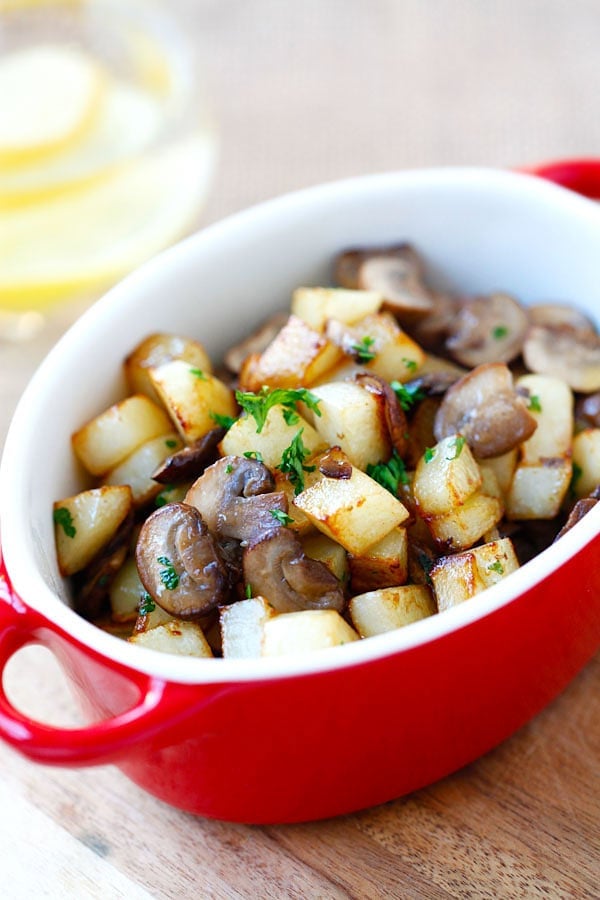 All in one pan sauteed potatoes with mushroom in a serving dish.