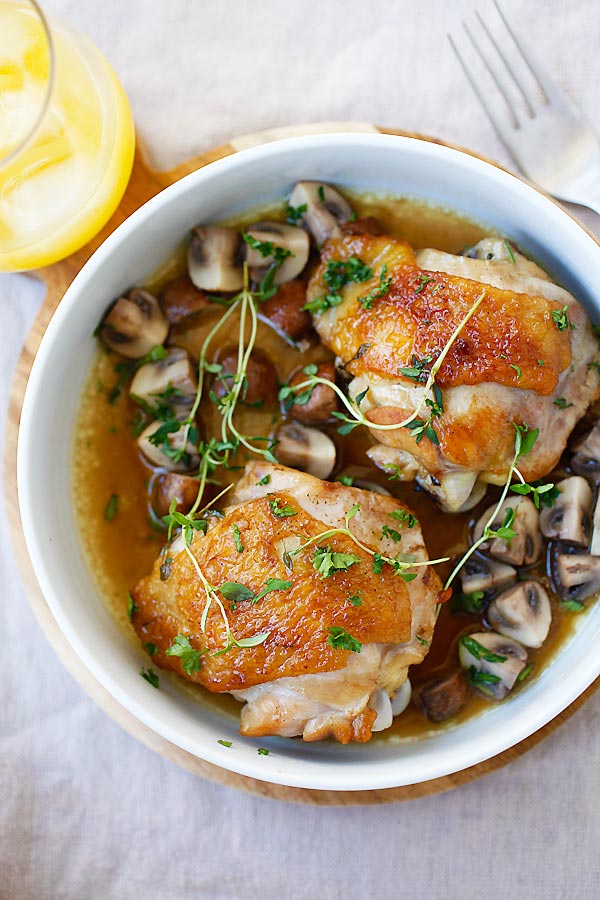 Chicken with Sauteed Mushroom with wine and chicken broth in serving dish.