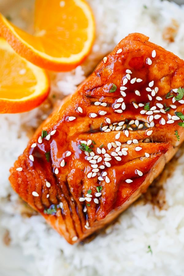 Close up Salmon with Orange Teriyaki Glaze garnished with sesame seeds.