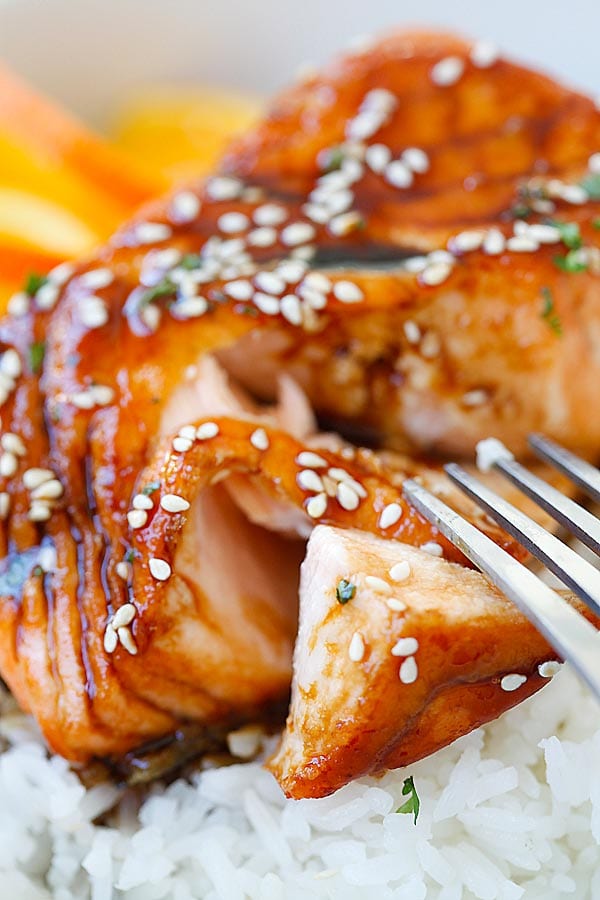 Salmon with Orange Teriyaki Glaze cut open with a fork.