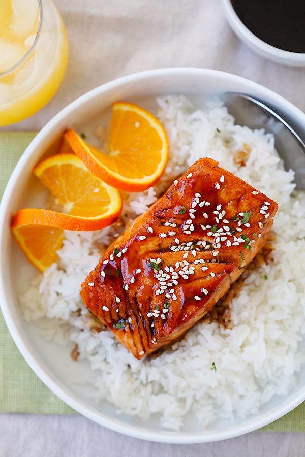 Juicy and delicious salmon with a tangy, sweet and savory orange teriyaki sauce in a bowl with rice.