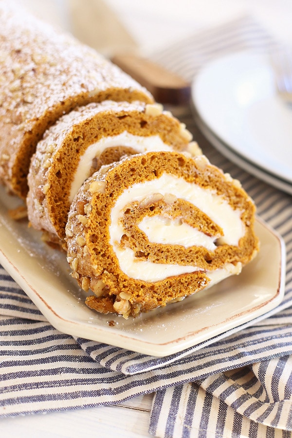 Easy homemade fall pumpkin roll cake, served in a serving dish.