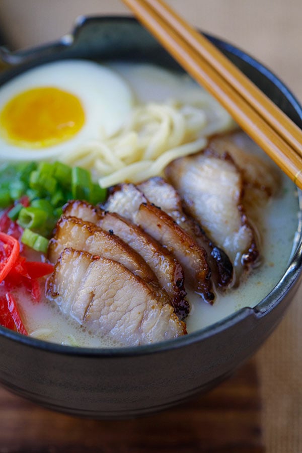 Easy and quick Chashu Ramen topped with Chinese char siu roasted pork belly, ramen soft boiled egg and garnished with chopped scallion, ready to serve.