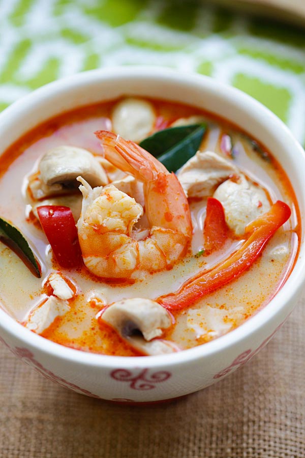 Thai Seafood Tom Yam Soup with prawns, chicken breast and mushroom in a bowl.
