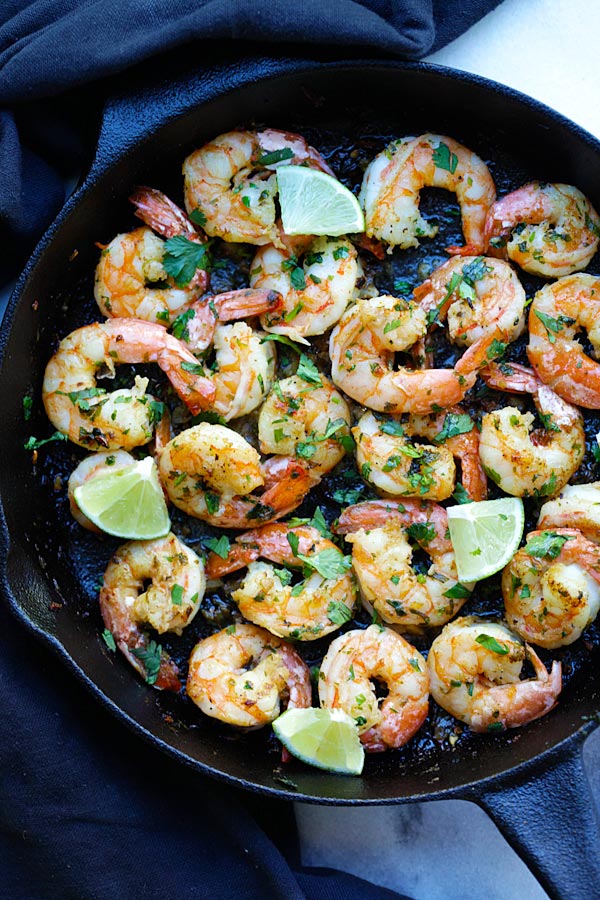 Cilantro Lime Shrimp with cilantro, lime and garlic on sizzling skillet.