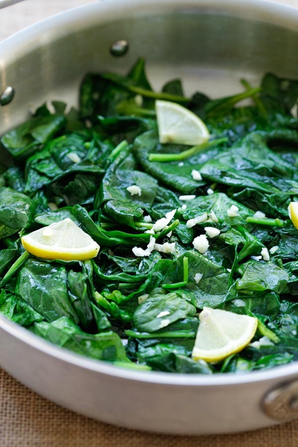 Easy and healthy garlic butter sauteed spinach recipe in a pot.