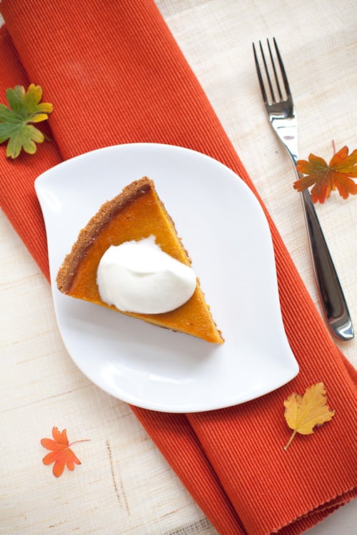 Easy homemade Kobocha pumpkin squash pie topped with cream.