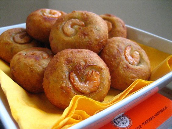 Cucur Badak recipe - Filled with grated coconut seasoned with turmeric, lemon grass, red chilies, and dried shrimps, the fillings are wrapped with sweet potatoes dough instead of glutinous rice. | rasamalaysia.com