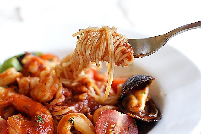 Angel Hair Pasta with Seafood Recipe - Florida rock shrimp, calamari rings, scallops, shrimp, mussels, cherry tomatoes, and freshly-plucked sweet basil leaves. | rasamalaysia.com