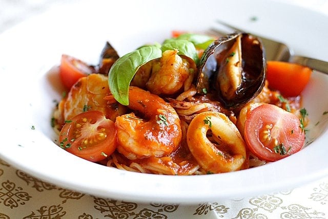 Angel Hair Pasta with Seafood Recipe - Florida rock shrimp, calamari rings, scallops, shrimp, mussels, cherry tomatoes, and freshly-plucked sweet basil leaves. | rasamalaysia.com