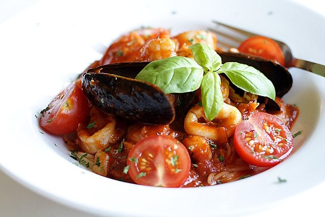 Angel Hair Pasta with Seafood Recipe - Florida rock shrimp, calamari rings, scallops, shrimp, mussels, cherry tomatoes, and freshly-plucked sweet basil leaves. | rasamalaysia.com