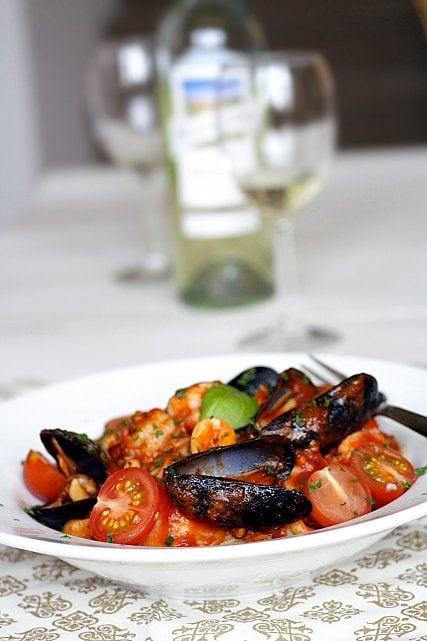 Angel Hair Pasta with Seafood Recipe - Florida rock shrimp, calamari rings, scallops, shrimp, mussels, cherry tomatoes, and freshly-plucked sweet basil leaves. | rasamalaysia.com