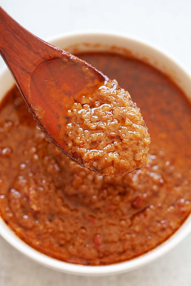 Satay sauce in a wooden spoon. 