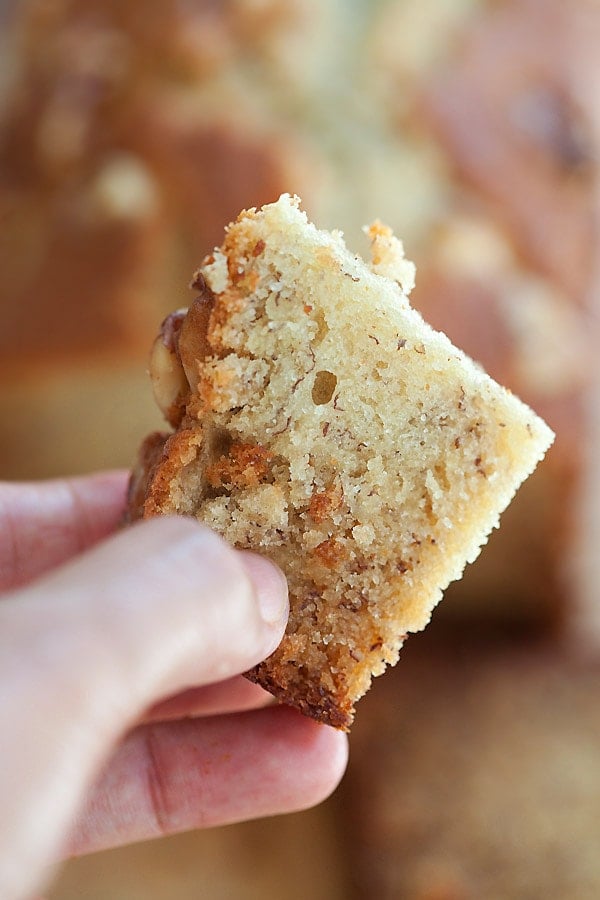 A slice of banana bread held in hand.