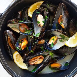 Steamed mussel pot (moules marinières) with white wine, garlic, and parsley.