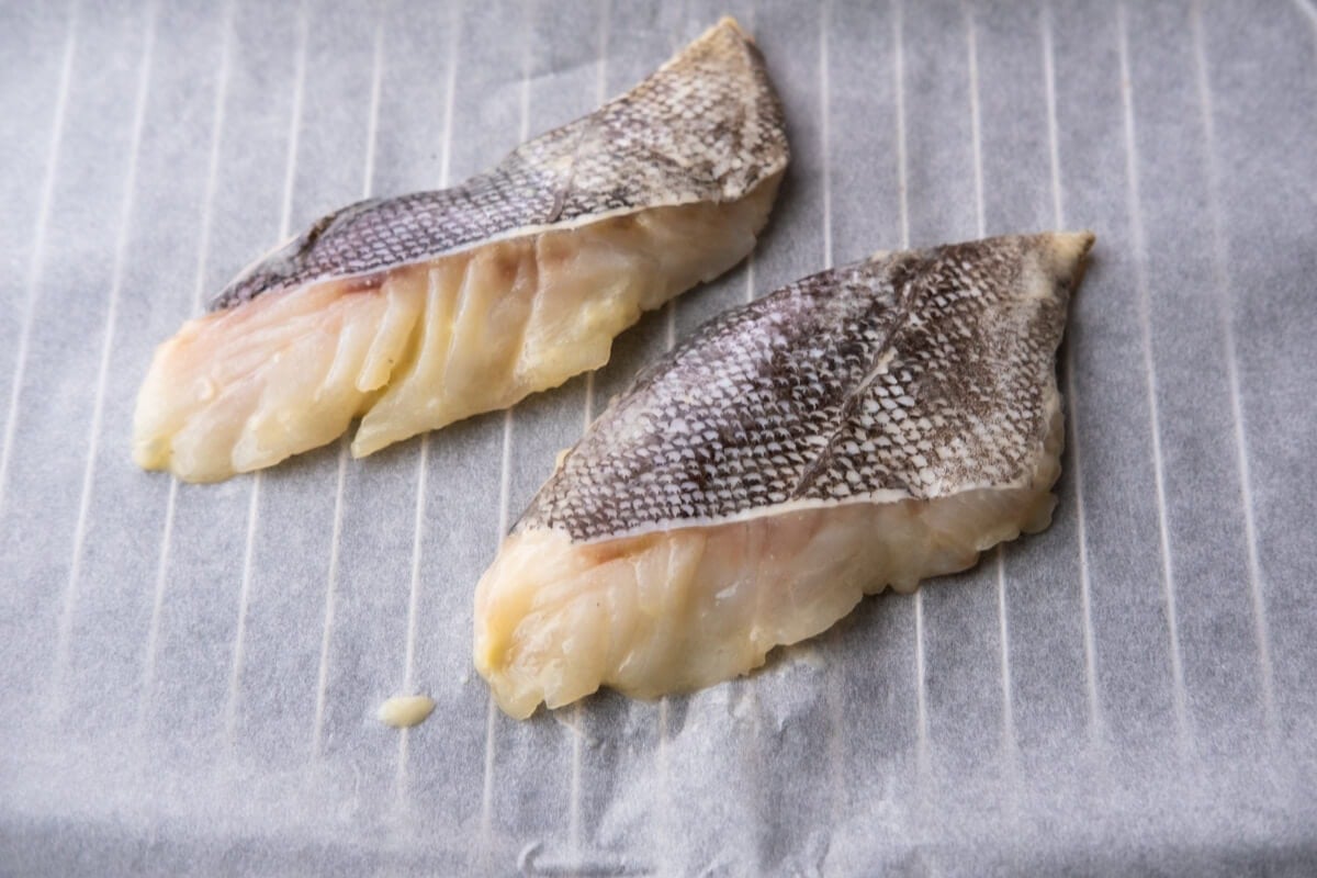 Placed the marinated sea bass on a baking pan lined with parchment paper. 