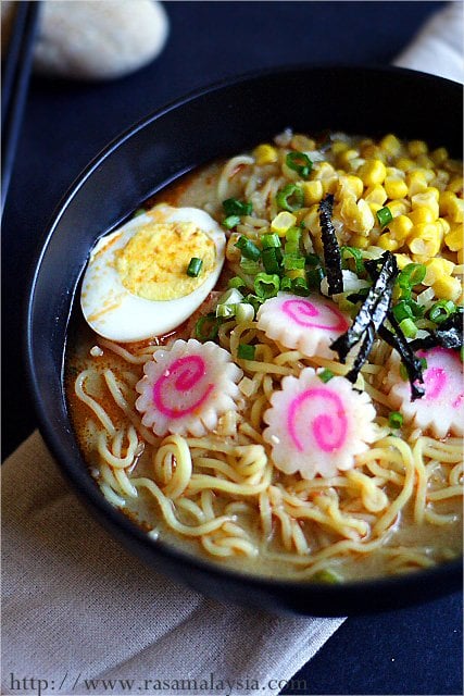 Miso Ramen with scallions, hard boiled egg, seaweed and corn in a bowl to be served