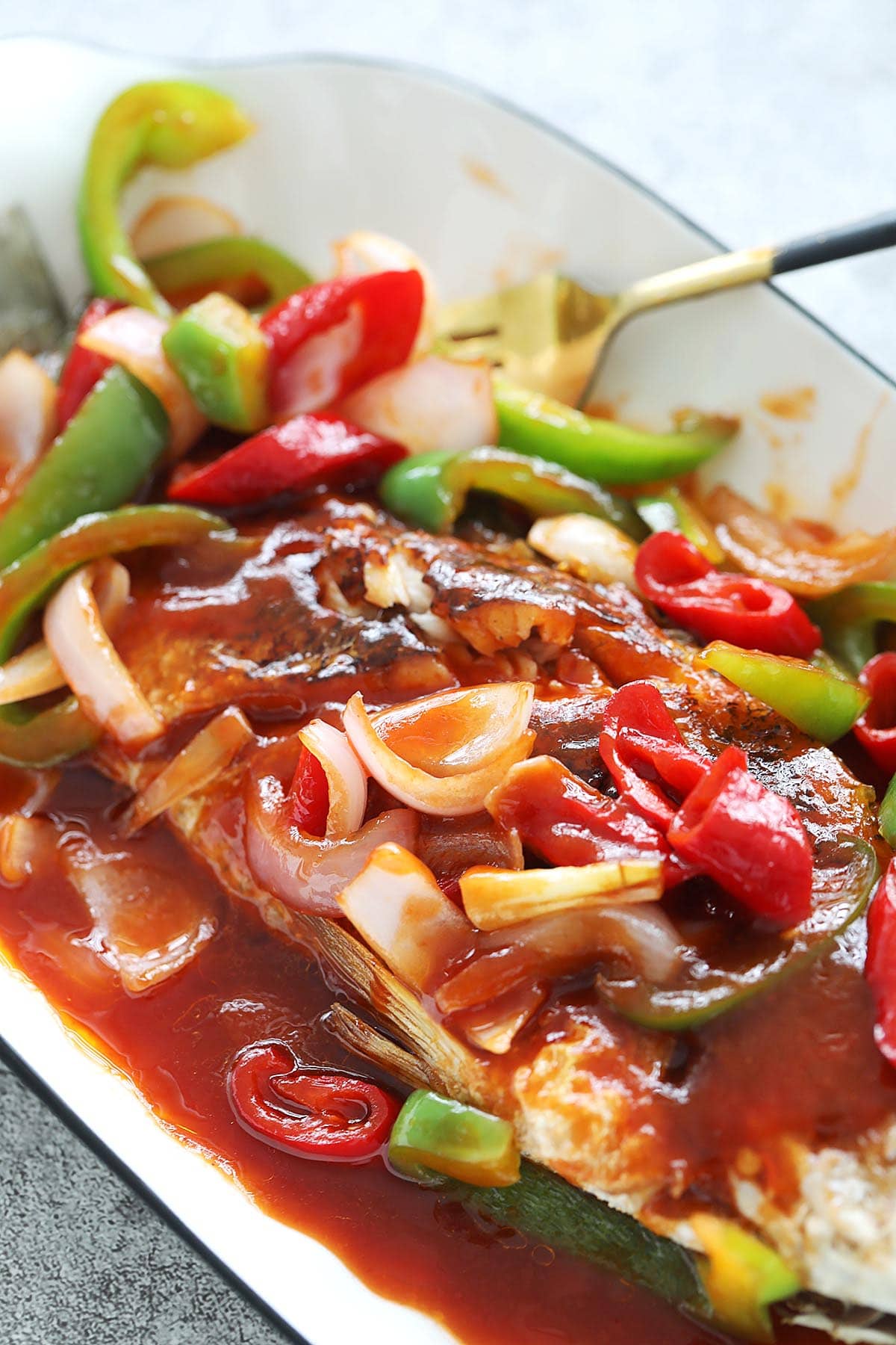 Sweet sour fish with vegetables and sauce. 