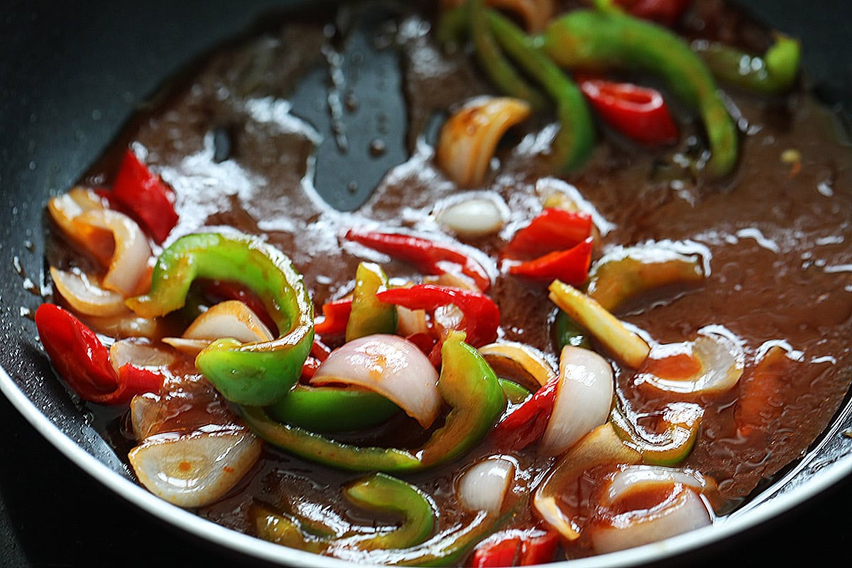 Making sweet and sour sauce in a skillet. 