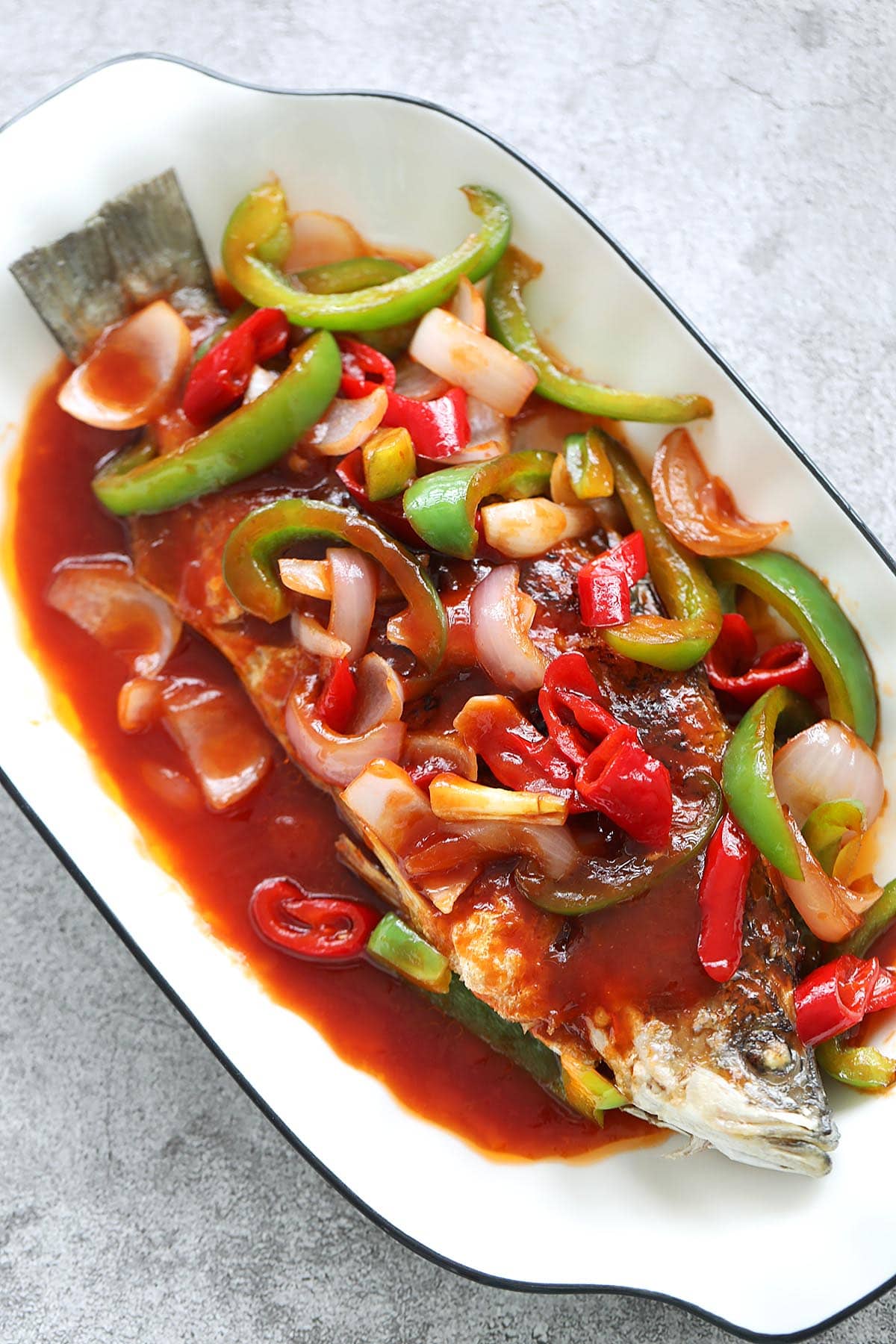 Sweet and sour fish served on a plate. 