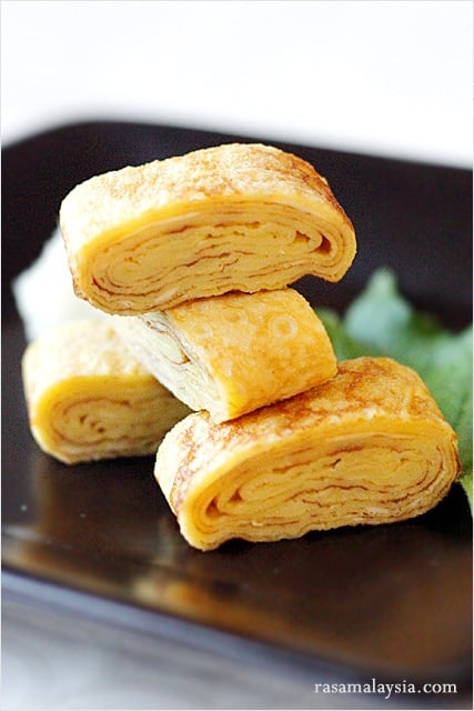 Tamagoyaki is a slightly sweet, delicious, and delicate omelet that is often packed into Japanese bento boxes and also served at sushi bars as tamago nigiri | rasamalaysia.com