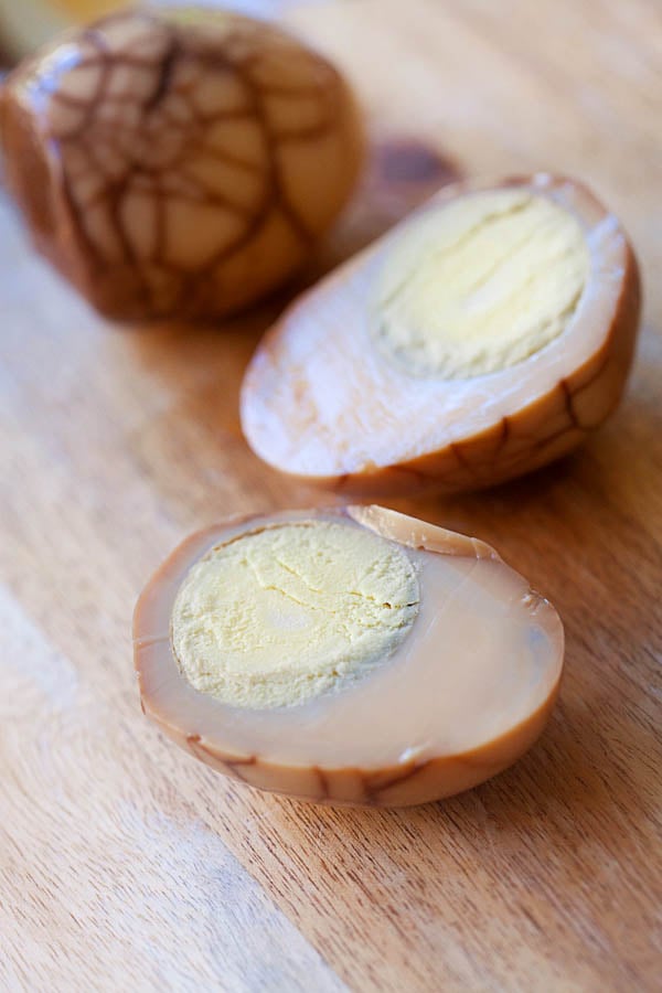 Chinese tea eggs on a chopping board. 