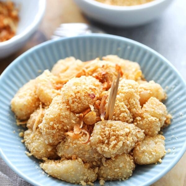 Muah chee or muar chee served on a plate with toothpicks.