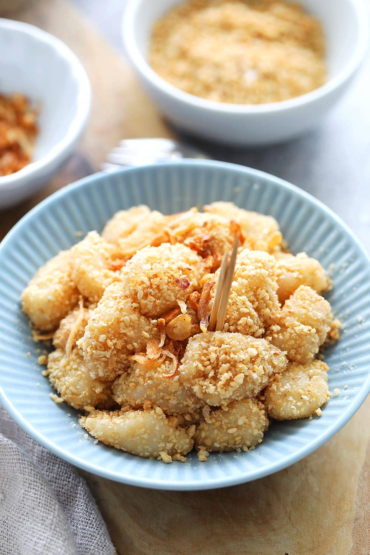 Muah chee or muar chee served on a plate with toothpicks. 