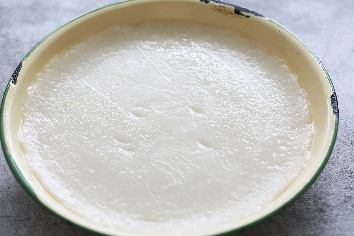 Steaming muah chee dough in a tray.