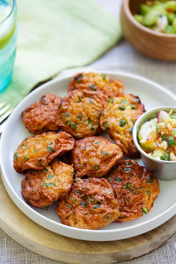 Easy and quick authentic Thai Fish Cakes in a plate with a side of dipping sauce.