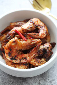 Assam prawns or tamarind prawns served in a bowl.