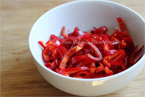 Chopped fresh chilies in bowl ready for grinding and pounding.
