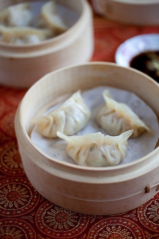 Steamed dumplings perfectly made in a bamboo steamer, ready to be served.