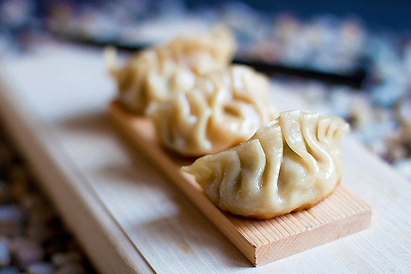 Gyoza or Japanese pan-fried dumplings are SO delicious. EASY gyoza recipe made with store-bought ingredients, cheap & a zillion times better than takeout. | rasamalaysia.com