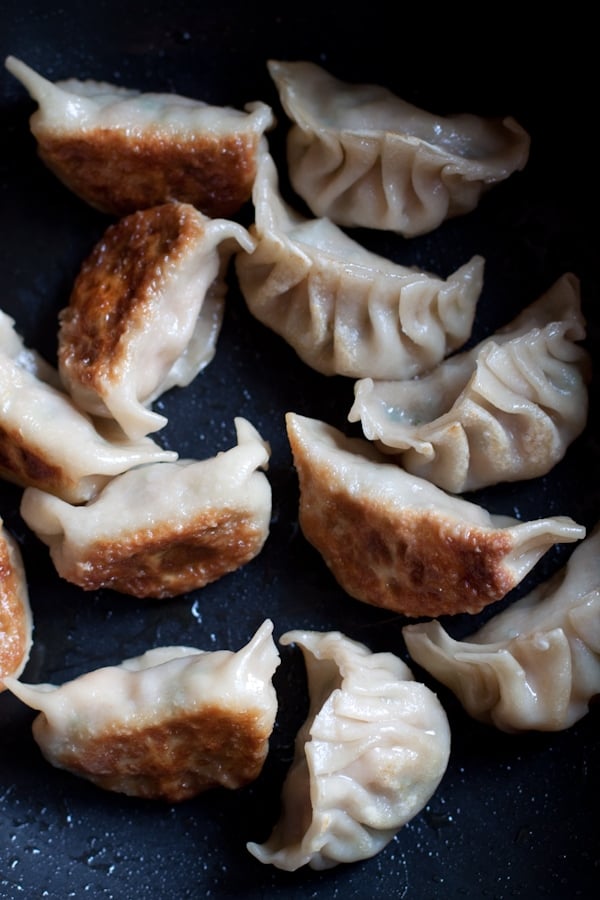 Gyoza or Japanese pan-fried dumplings are SO delicious. EASY gyoza recipe made with store-bought ingredients, cheap & a zillion times better than takeout. | rasamalaysia.com