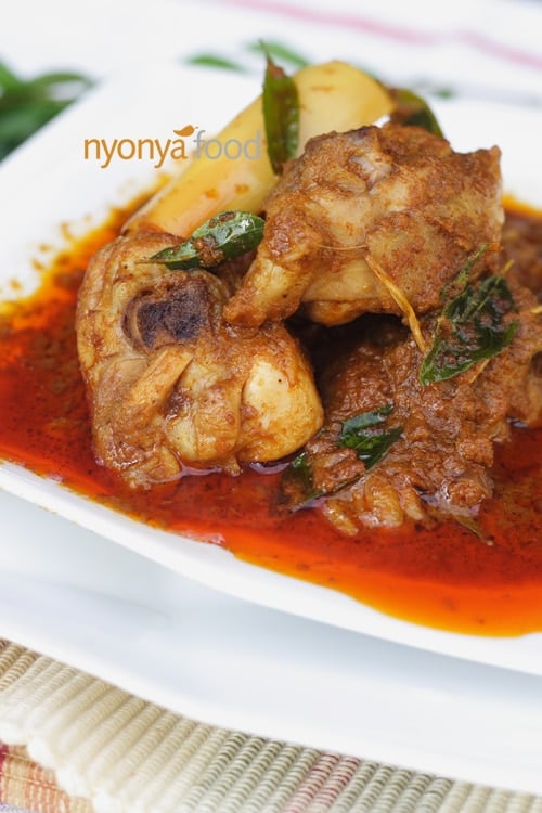 Chicken curry is made with bone-in chicken traditionally, and curry leaves are used to infuse the chicken curry with the intense fragrance of the curry leaves. | rasamalaysia.com
