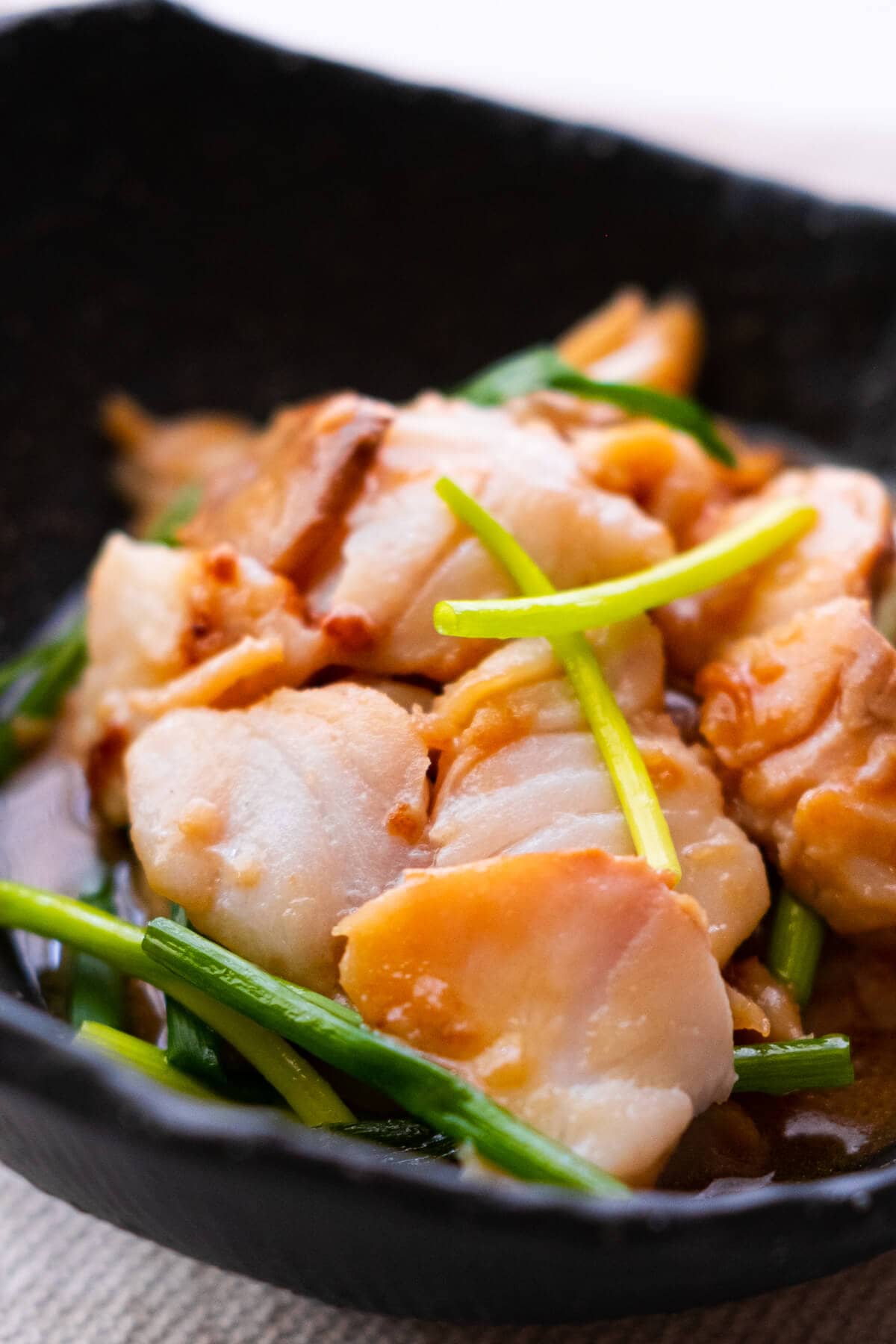 A quick and easy ginger and scallion fish recipe with fish fillet, ginger, and scallions. 
