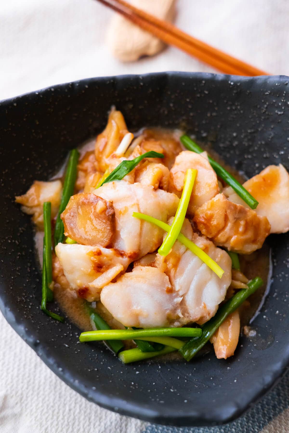 A quick and easy ginger and scallion fish recipe with fish fillet, ginger, and scallions. 
