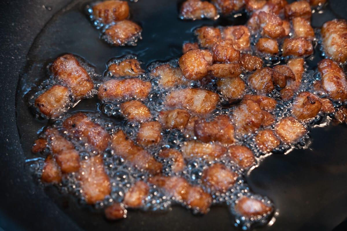 Pork fat and pork lard in a wok.