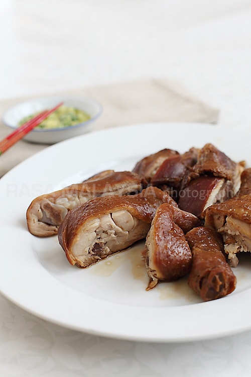 Soy Sauce Chicken - dark and glossy whole chicken dunked in a soy sauce mix. Also try dipping it with the ginger and scallion condiment. | rasamalaysia.com
