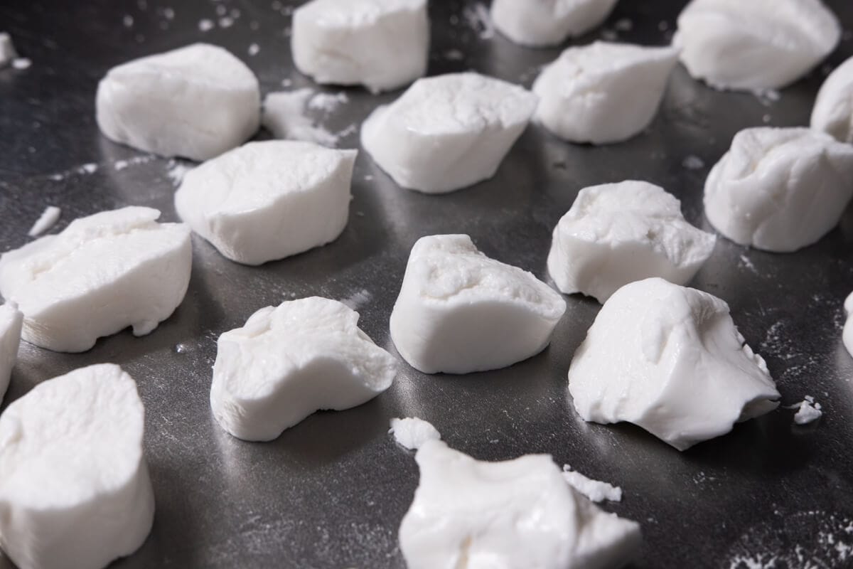 Dumpling wrapper dough on a working surface. 