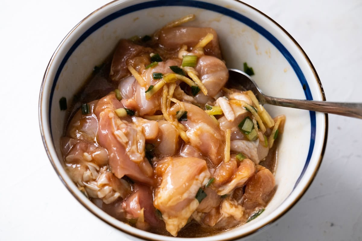 Marinating chicken in a bowl. 