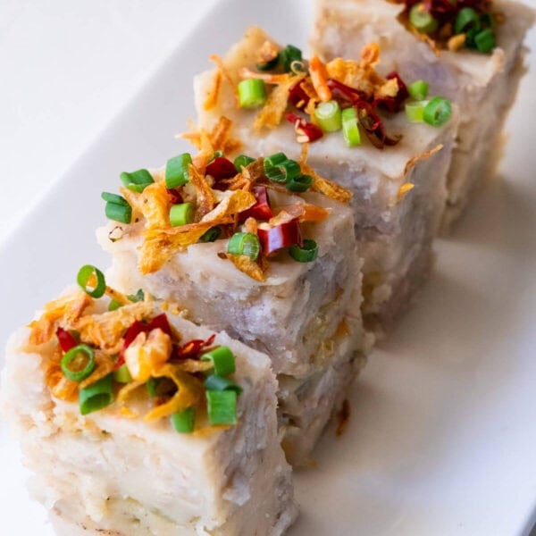 Sliced yam cakes served on a plate.