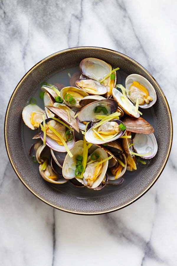 Easy and quick Chinese style soup with clams and ginger served in a serving dish.