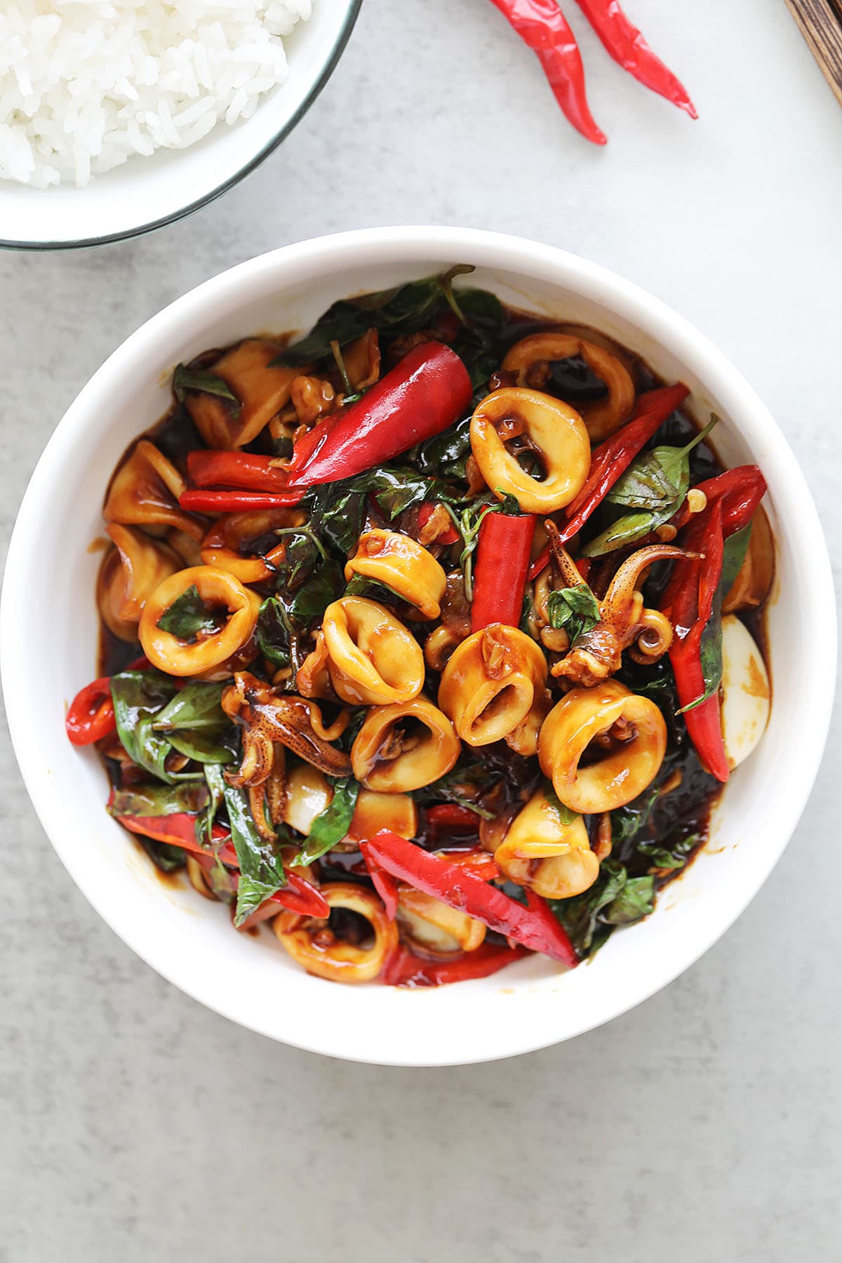 Chinese three cup squid with red chilies and basil leaves. 