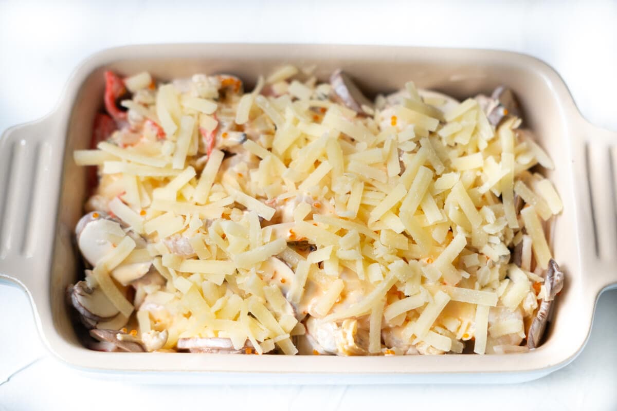 Dynamite seafood topped with shredded cheese before baking. 