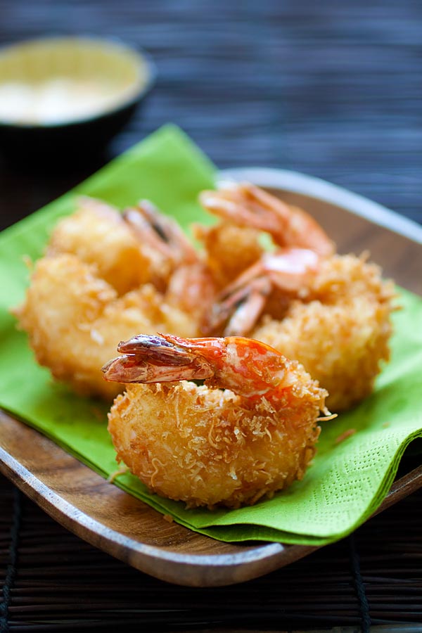 Fried coconut shrimp recipe that yields jumbo coconut shrimp, ready to serve on a plate.